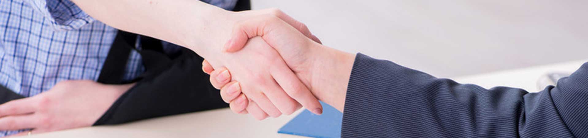 Handshake by attorney and the plaintiff who is an injured worker