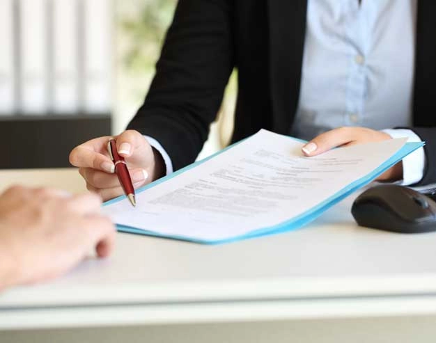 Legal professional presenting a concise deposition summary report for attorney case review
