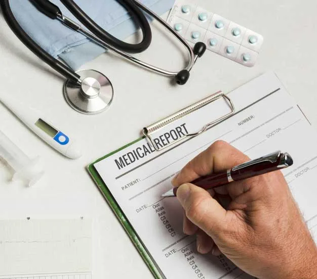 Medical professional documenting medical findings on a medical records for a legal chronology review